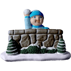Village Snowball Boy by Wall Statue